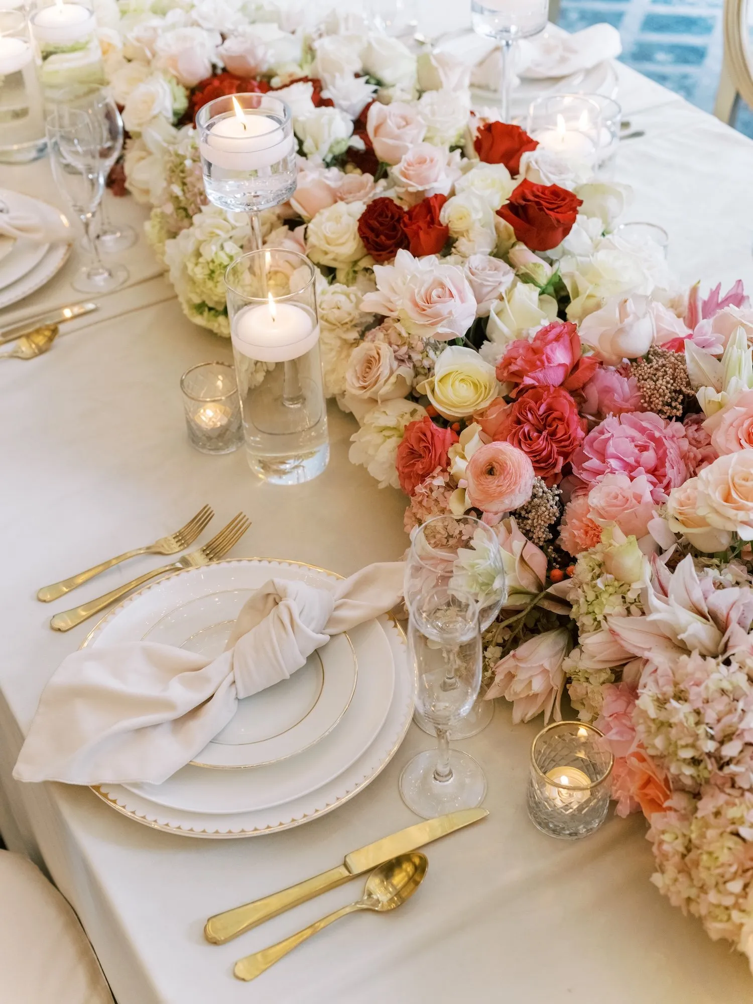 Crimson, blush, and cream king's table at The Four Seasons Denver