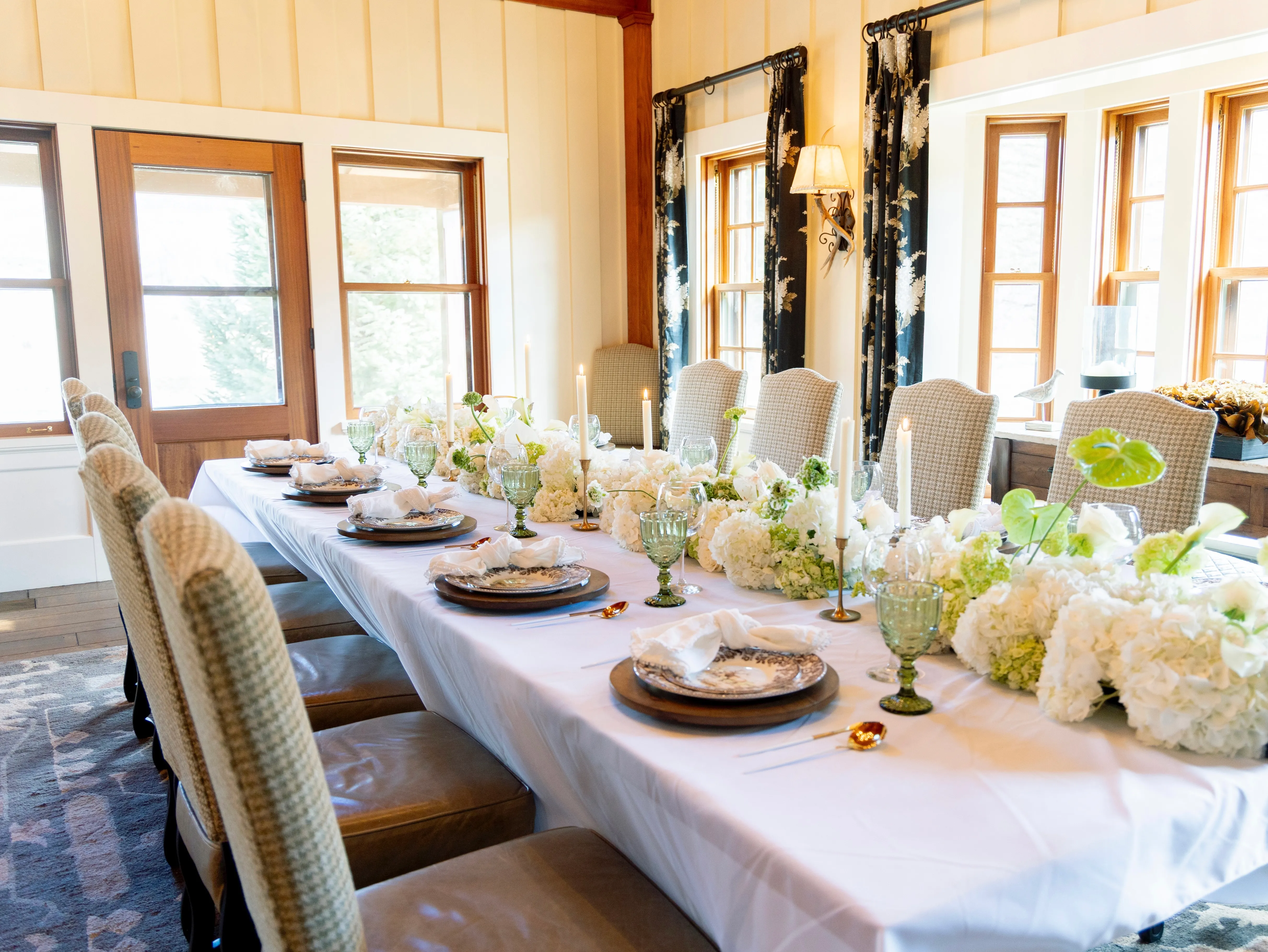 White and chartreuse floral table arrangement at a private Vail mountain-home event