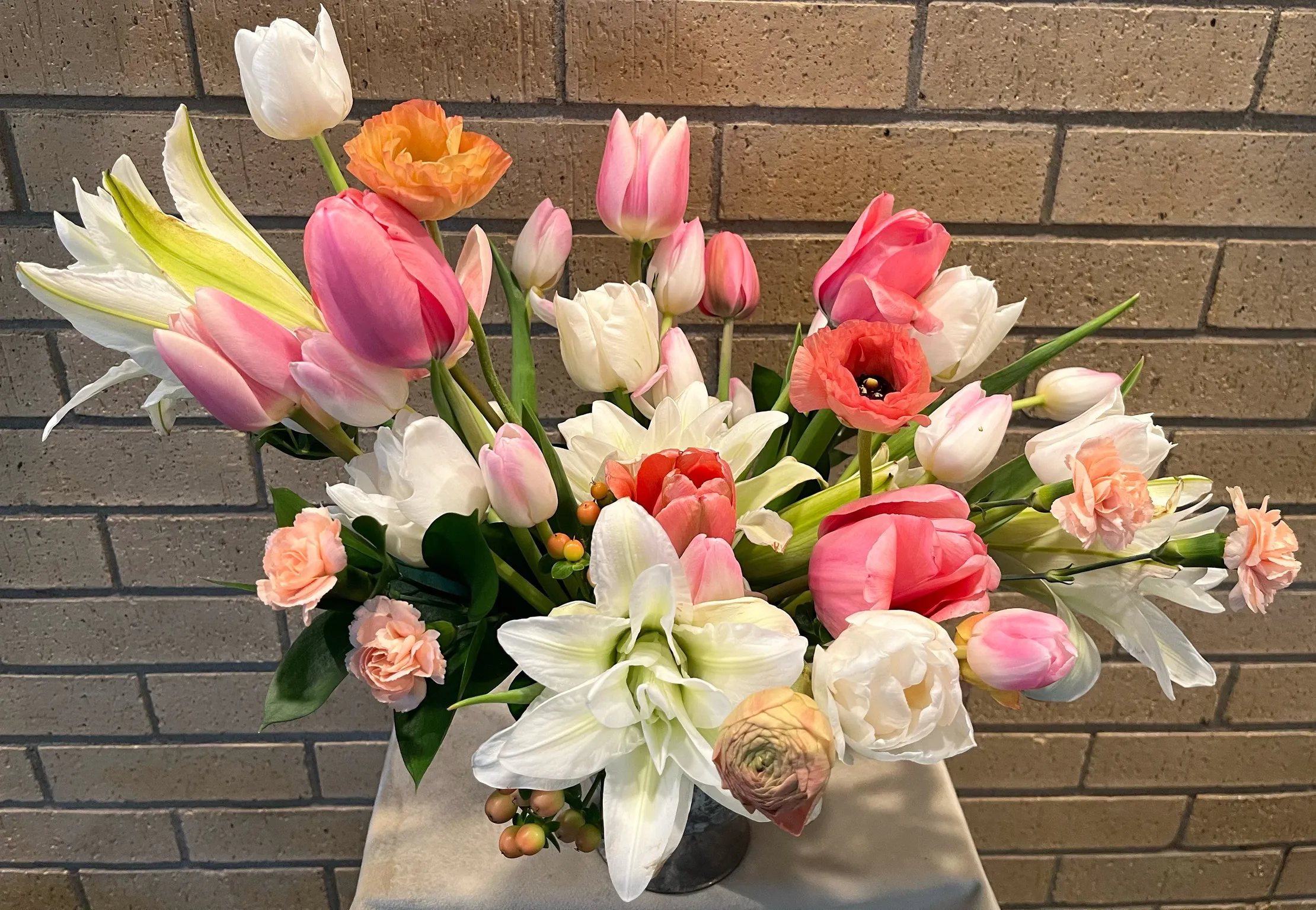Pink and white spring flowers with tulips and lilies