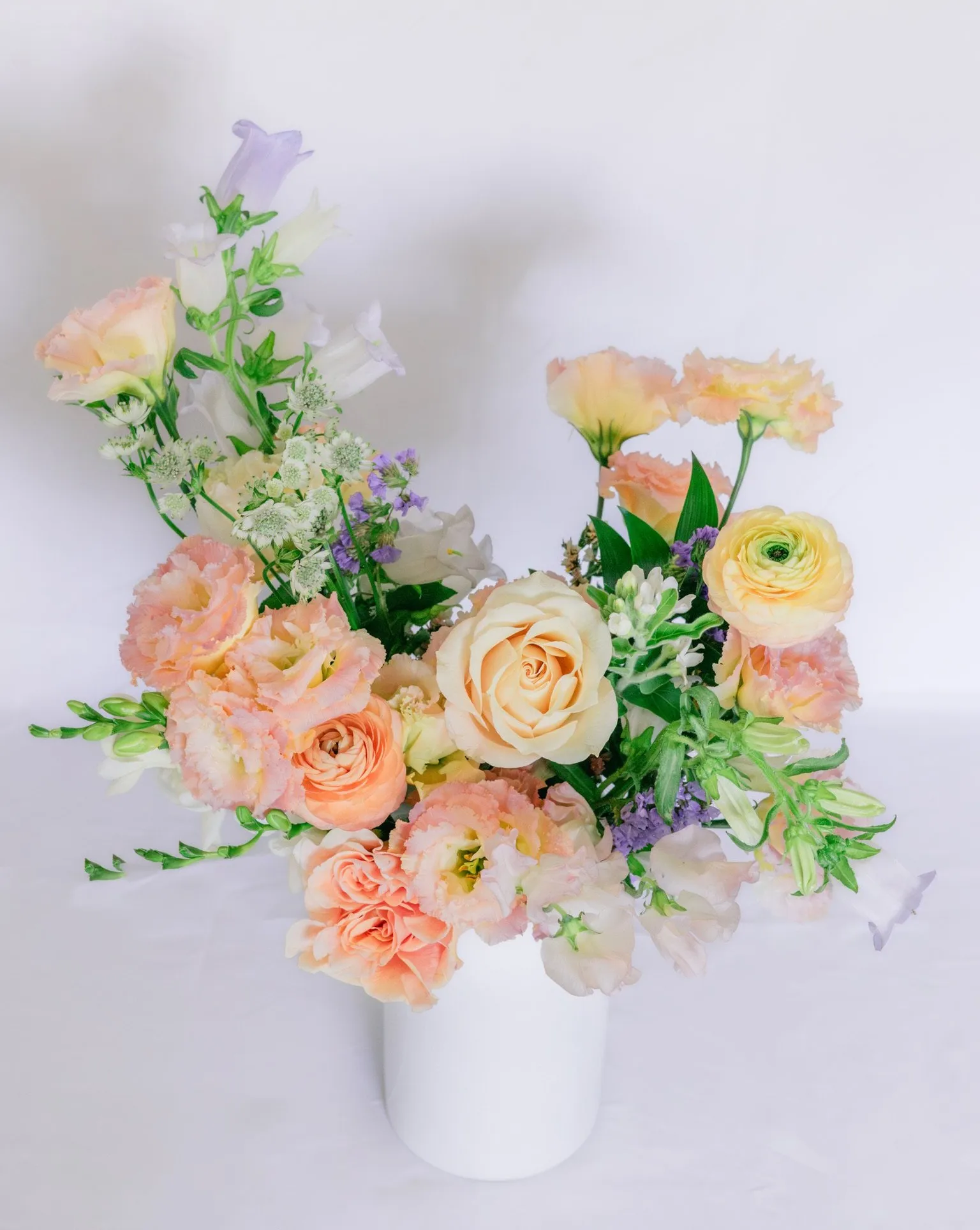 Celebration Bouquet with vibrant red, orange, and yellow florals